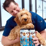 Backcountry Brewing | Throw Me A Frickin Bone Here | Pale Ale - Man with dog and a pack of cans