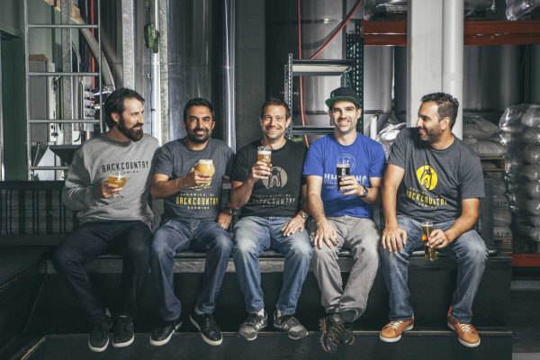 Backcountry Brewing | About Us - Five founders enjoying a beer