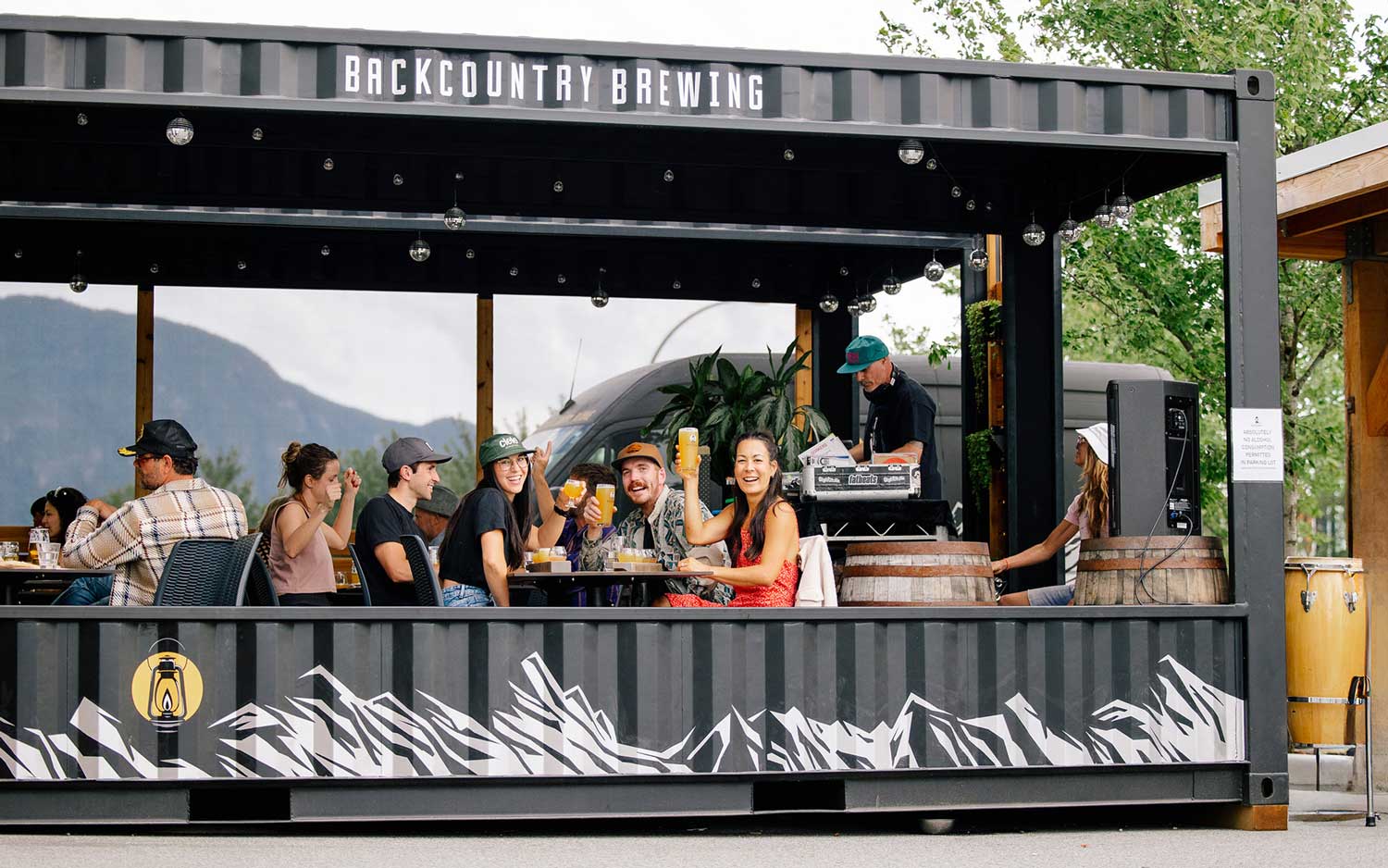 Backcountry Brewing - Image of patrons drinking on the Backcountry outdoor patio.